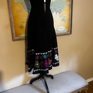 Size 10 A-line skirt with beautifully embroidered hemline.